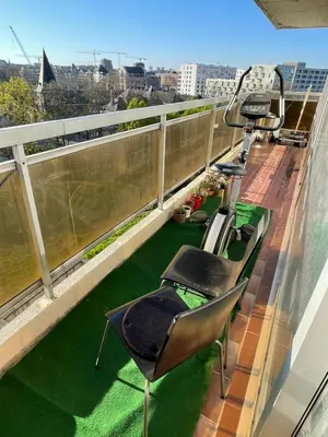 a balcony with chairs and grass on a roof at Cosy appartment near city center in Brussels