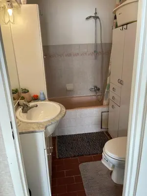 a small bathroom with a sink and a toilet at Cosy appartment near city center in Brussels
