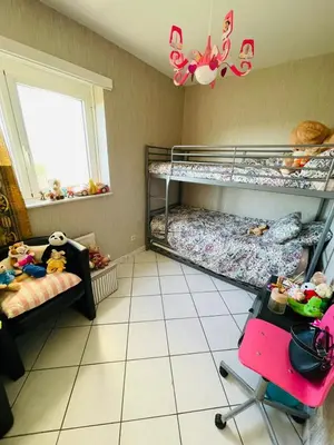 a bedroom with two bunk beds and a window at Cosy appartment near city center in Brussels