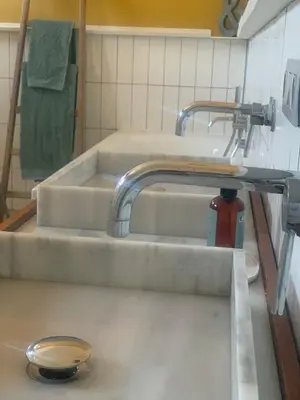 a kitchen with two sinks in a bathroom at Heritage Mansion near Tomorrowland in Niel