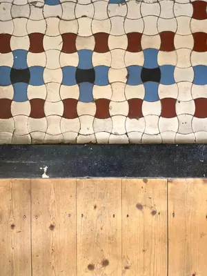 a close up of a floor with brown and white tiles at Charming Family Townhouse in Antwerp in Antwerp