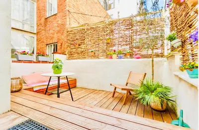 a small balcony with a table and chairs at Heart of Antwerp House in Antwerp