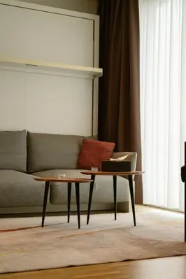 a living room with a couch and a coffee table at Elios Living Studio Mettewie in Brussels