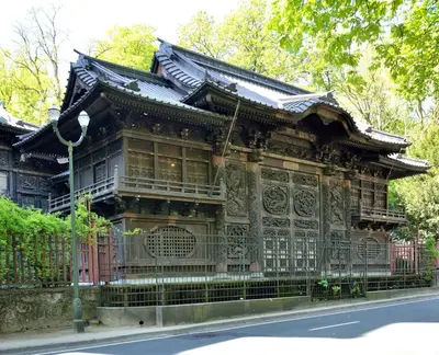 an old building with a fence in front of it at Chinese Pavilion Park - Magnificent Apartment Brussels in Brussels