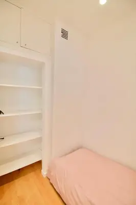 a bedroom with a bed and a closet at Very nice & large studio-Plasky in Brussels