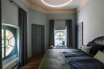a bedroom with a bed and a window at Paviljoen De Notelaer in Bornem