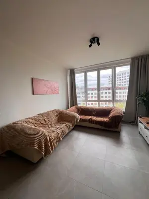 a bedroom with a bed and a large window at Cozy Feels, Central Vibes in Antwerp