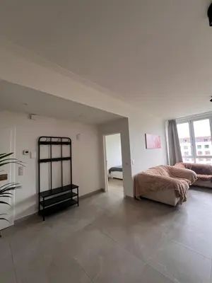 a bedroom with a bed and a large window at Cozy Feels, Central Vibes in Antwerp