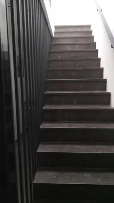 a set of stairs leading up to a building at Appartement boom 2,1 km van tomorrowland in Boom