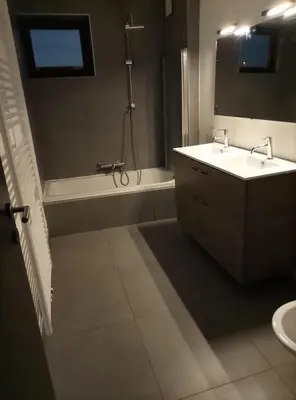 a bathroom with a tub and a sink and a bath tub at Appartement boom 2,1 km van tomorrowland in Boom