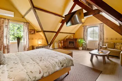 a bedroom with a large bed in a room at thomas van der vekenlaan in Brecht