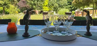 a table with wine glasses on top of it at thomas van der vekenlaan in Brecht