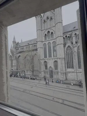 a large building with people standing in front of it at Gent-cosy-stay in Ghent