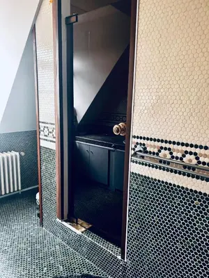a bathroom with a shower with a mirror at Luxury Hotel-Villa Schaffen in Diest