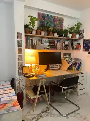 an office with a desk with a computer on it at Petit coin de cosyness in Brussels