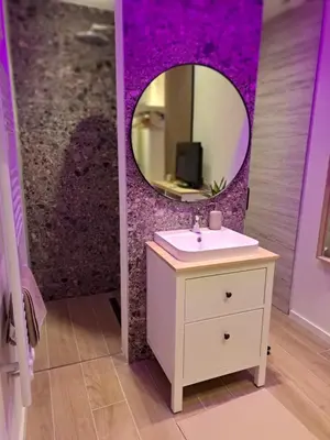 a bathroom with a sink and a mirror at Boomgaard de Luxe in Antwerp