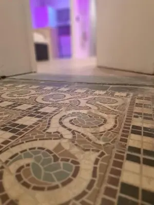 a tile floor with a mosaic pattern on it at Boomgaard de Luxe in Antwerp