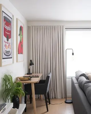 a living room with a table and a couch at Anno in Ghent