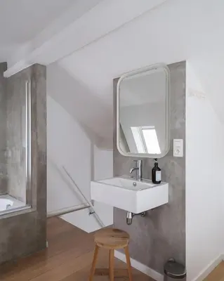 a bathroom with a sink and a mirror at Anno in Ghent