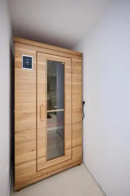 a wooden door in the corner of a room at Toison d'Or & Sauna in Brussels