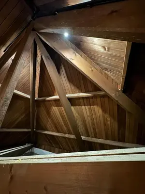 an attic with a wooden ceiling at Sensi Waters in Duffel