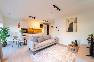 a living room with a couch and a table at Fourstay Luxury City Apartments Diegem - Brussels in Diegem