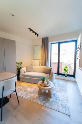 a living room with a couch and a table at Fourstay Luxury City Apartments Diegem - Brussels in Diegem