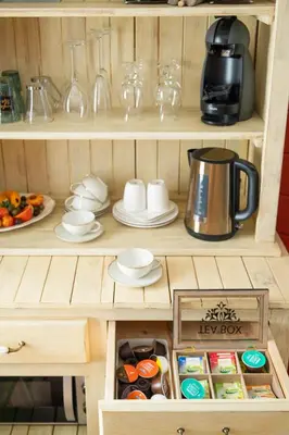 a cupboard with a coffee maker and a tea kettle at Stijl en kleur in Diest