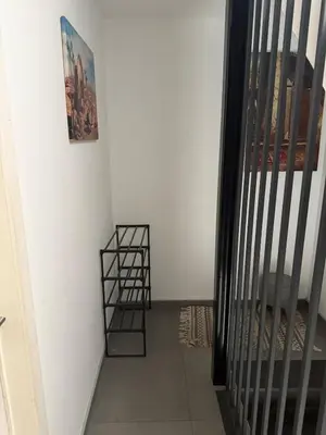 a stairway with a shelf next to a white wall at Apartment Boom 200m from centrm in Boom