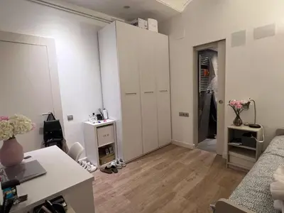 a white living room with a desk and a room at Skyline Stay Brussel Elegant Views in Brussels