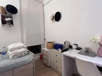 a room with a desk and a sink and a mirror at Skyline Stay Brussel Elegant Views in Brussels