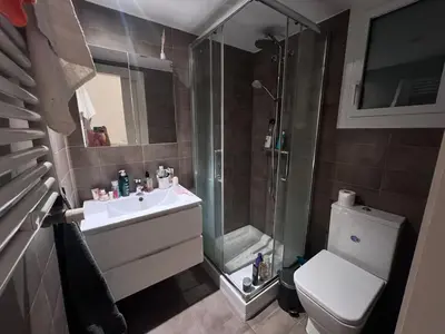 a bathroom with a shower and a sink and a toilet at Skyline Stay Brussel Elegant Views in Brussels