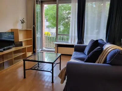 a living room with a couch and a coffee table at Nice studio EU Quarter in Brussels