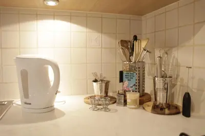 a kitchen counter with utensils on a counter top at Sunny Stay & Chill in Brussels