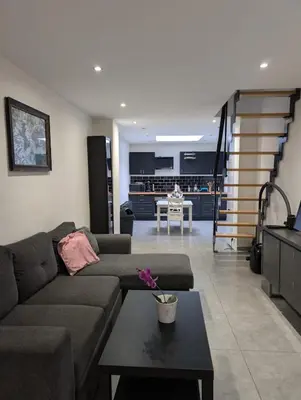 a living room with a couch and a table at Full apartment near Brussels and Zaventem in Vilvoorde