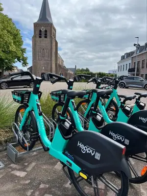 a row of bikes parked in a parking lot at PipoParel in Ravels