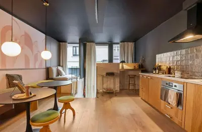 a kitchen with a table and chairs and a dining room at Boutique apartment Antwerp in Antwerp