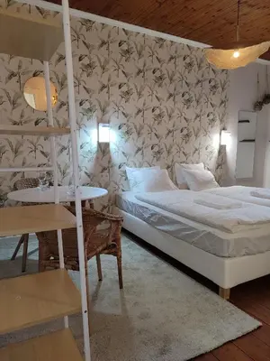 a bedroom with a bunk bed and a table at cosy studio2 in Antwerp