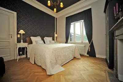 a bedroom with a bed and a window at Guesthouse Expo 13 in Ghent