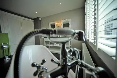 a bathroom with a sink and a bath tub at Guesthouse Expo 13 in Ghent
