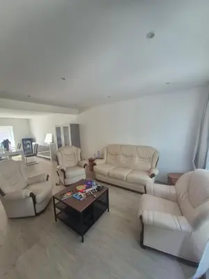 a living room with couches and a coffee table at Genius BNB Buyl 2BR Terrace Near City Center Brussels in Brussels