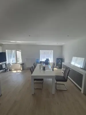 a living room with a white table and chairs at Genius BNB Buyl 2BR Terrace Near City Center Brussels in Brussels