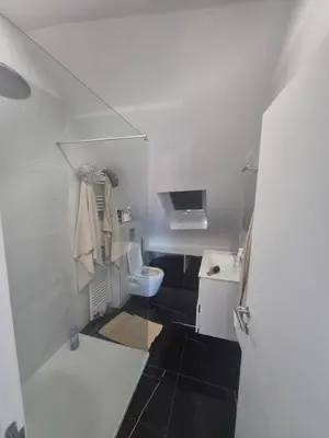 a small bathroom with a toilet and a sink at Genius BNB Buyl 2BR Terrace Near City Center Brussels in Brussels
