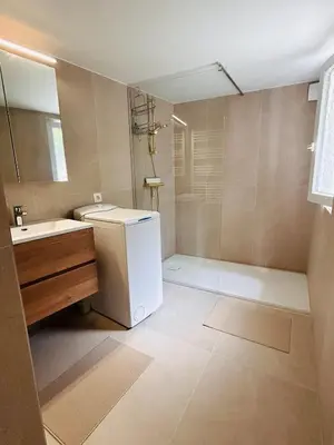 a bathroom with a shower and a toilet and a sink at Cosy small studio in Brussels