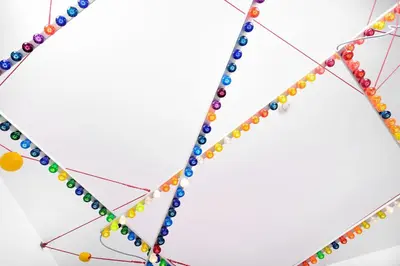 a group of colored beads on a wire at B&B DRUUM in Brussels