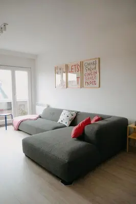 a living room with a couch and a bed at Casa Congé - Colorful Stay & Free Wine Bottle in Mechelen
