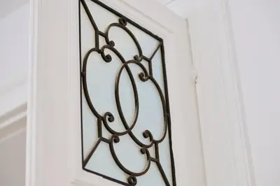 a mirror hanging on a wall in a room at Louise City Center in Brussels
