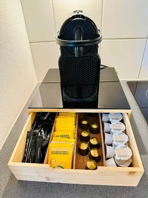 a drawer with a coffee pot on top of it at Grand Place - Prime Location 2 Bedroom Apartment in Brussels