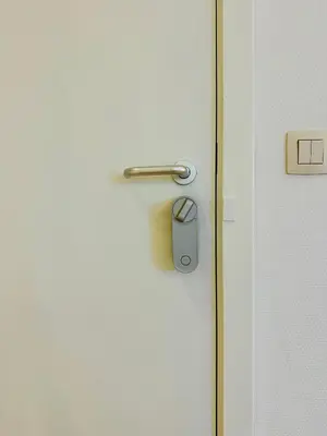 a door with a lock on a white door at Grand Place - Prime Location 2 Bedroom Apartment in Brussels