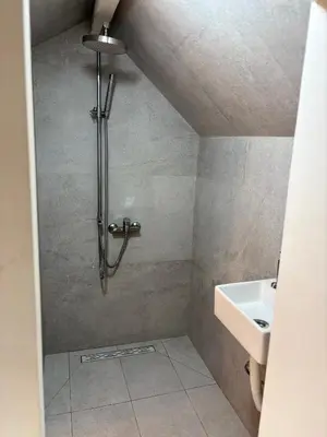 a bathroom with a shower and a sink at Marie home in Brussels